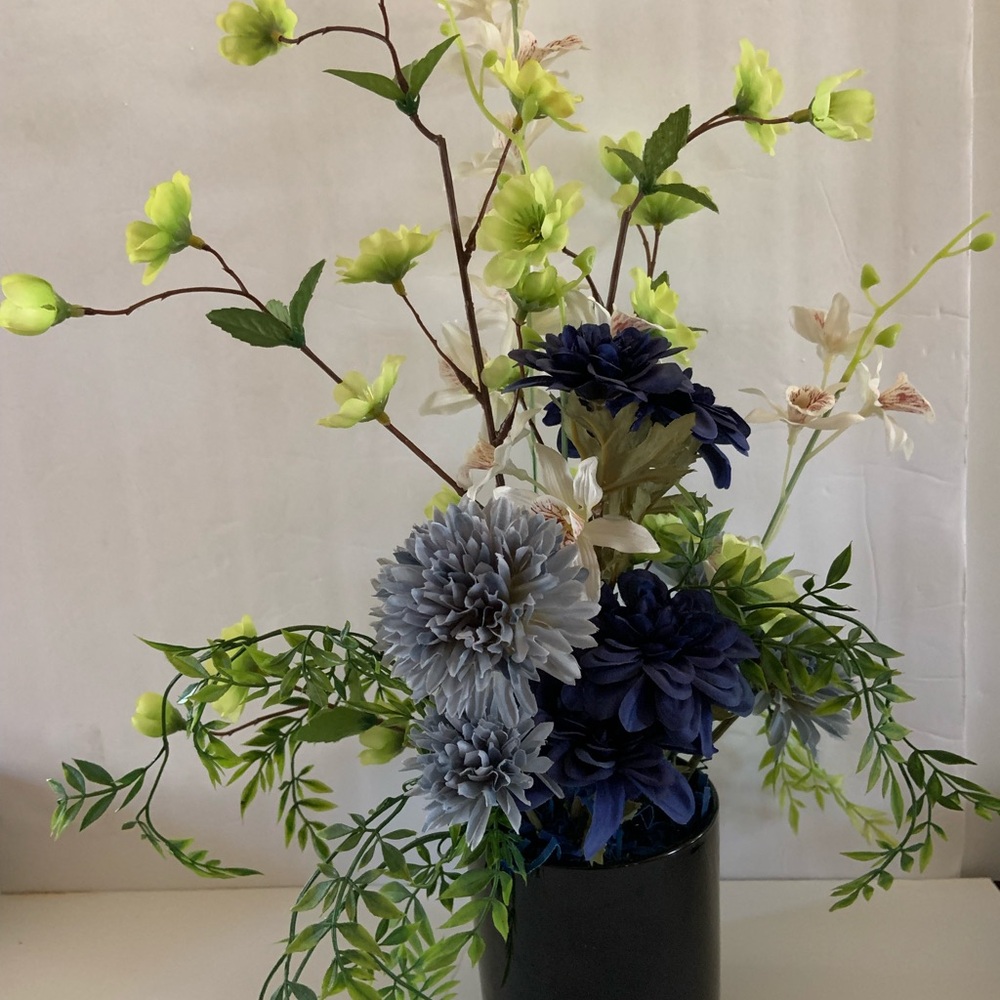 Handcrafted Elegant Floral Arrangement in cobalt blue base.